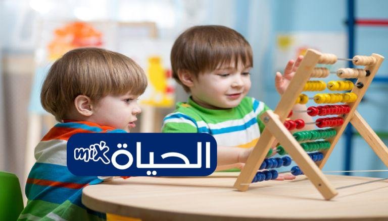 205 093800 preschooler children boys play with counter toy 3